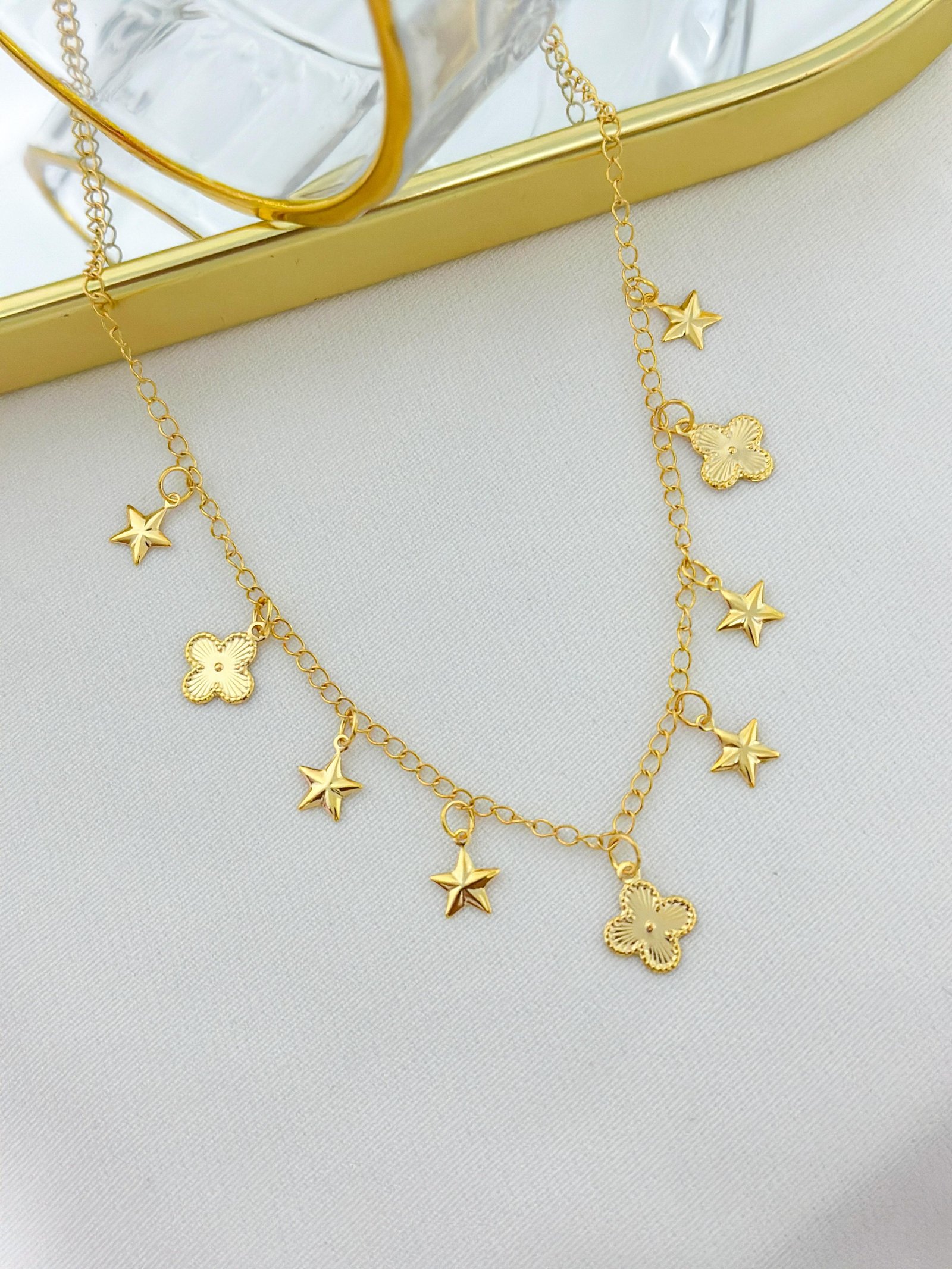 Chocker Folheada Estrela E Trevo Dourada